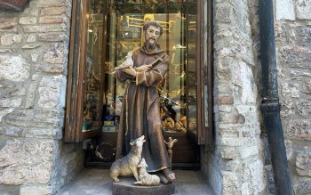 A statue of St. Francis is seen in a storefront on a street in Assisi, Italy, Feb. 22, 2026.