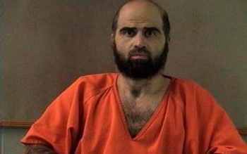 Nidal Hasan, charged with killing 13 people and wounding 32 in a November 2009 shooting spree at Fort Hood, is pictured in an undated handout photo obtained by Reuters on June 29, 2012.